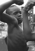 Load image into Gallery viewer, Muscle Boy by Leonard Freed, Harlem, Black-and-White Photography of African American Children 1960s