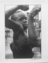 Load image into Gallery viewer, Muscle Boy by Leonard Freed, Harlem, Black-and-White Photography of African American Children 1960s.