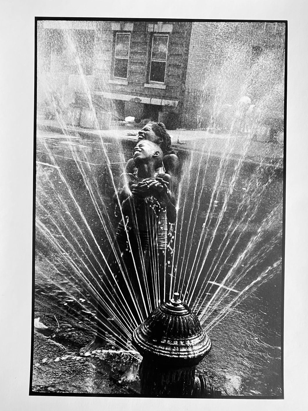 Fire Hydrant, New York by Leonard Freed, Black-and-White Photograph of African-American Children Playing in Harlem Street 1960s