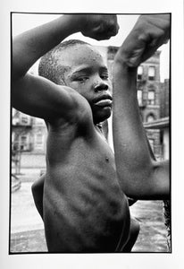 Muscle Boy, Harlem, New York City by Leonard Freed, Black and White Street Photography 1960s African Americans by Leonard Freed