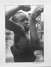 Load image into Gallery viewer, Muscle Boy by Leonard Freed, Harlem, Black-and-White Photography of African American Children 1960s.
