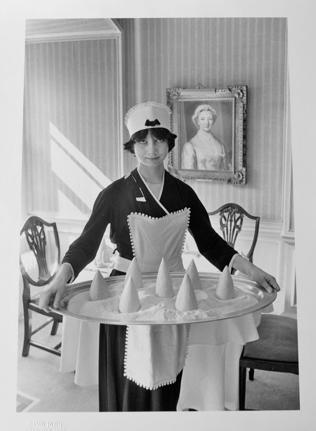Untitled, Portrait Photography of Woman Dressed as French Maid by David Hurn